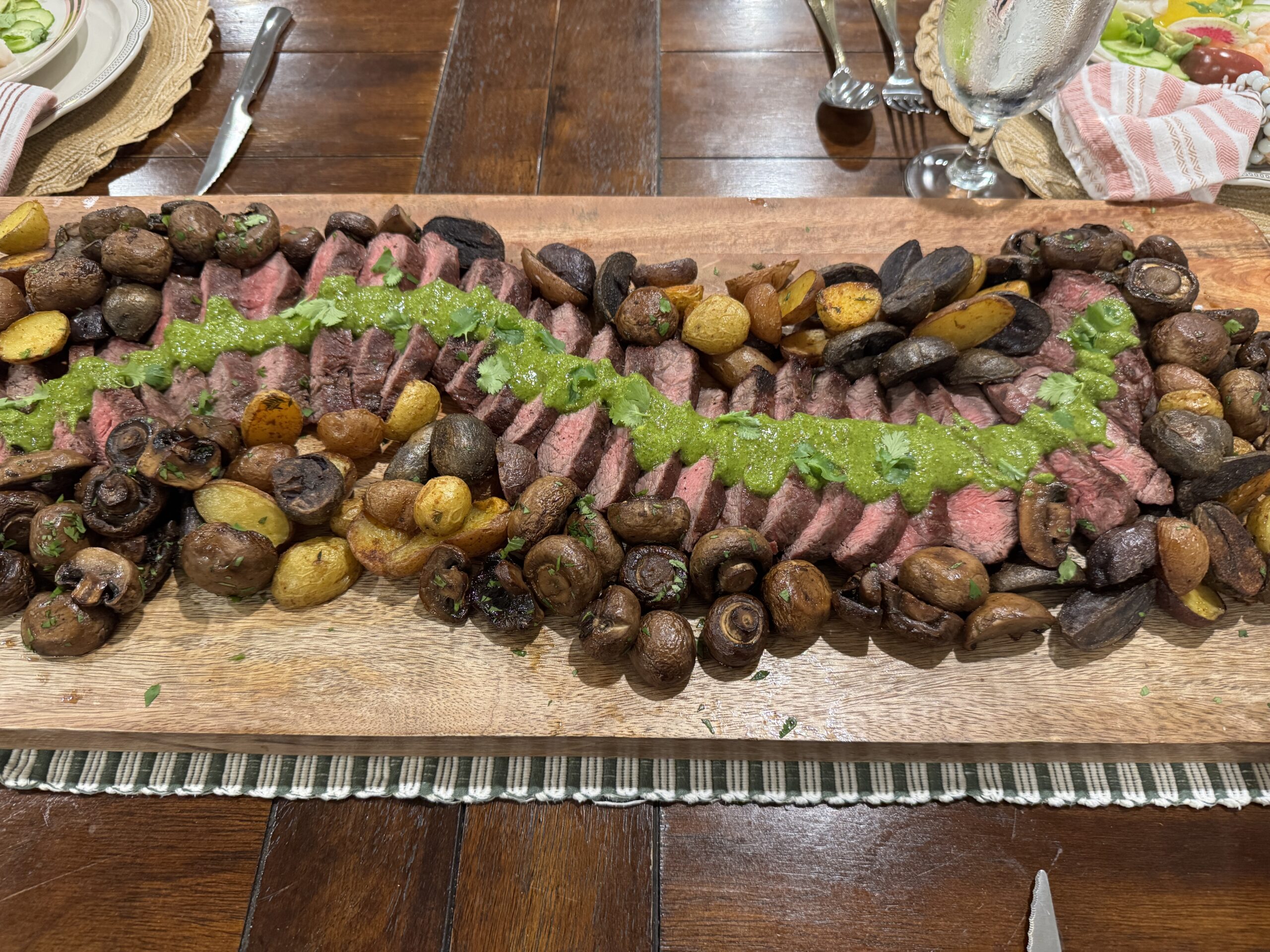Flat-iron steak on a serving board.